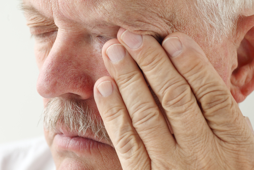 Elderly man suffering from a corneal injury