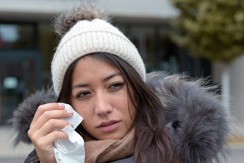 Young woman suffering from dry eyes