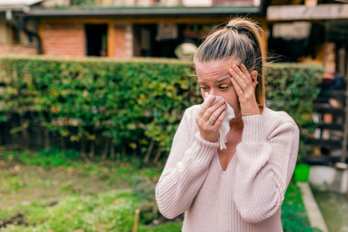 Young woman suffering from dry eyes and allergies