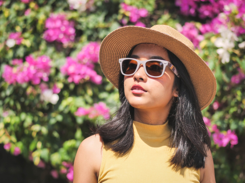 Young woman wearing sunglasses after LASIK