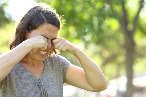 woman rubbing her dry eyes