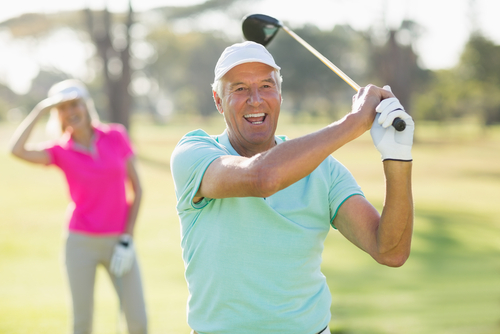 older man golfing