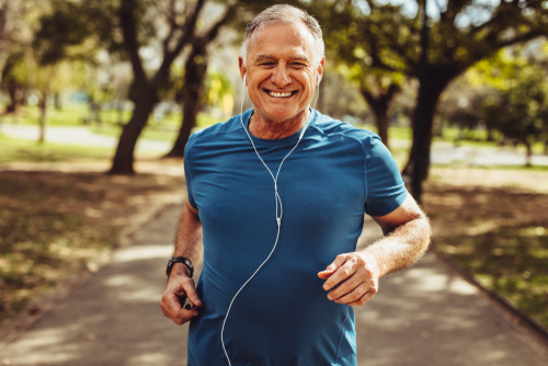 old man jogging at a park